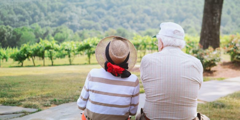 elderly couple looking at mountains